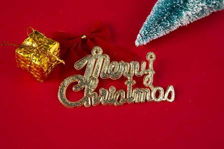 圣诞节平安夜红底图纯色金色字母蝴蝶结礼物