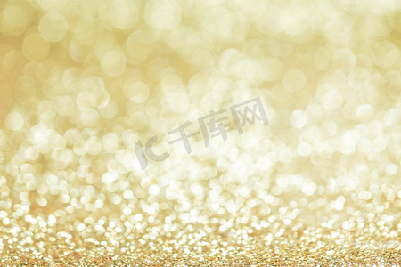 闪亮的金bokeh闪光的光抽象背景，圣诞节新年聚会庆祝概念。闪亮的金色灯光背景