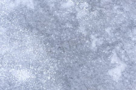 蓝色雪花摄影照片_抽象冬天背景/灰色冰与雪，文本的背景。抽象背景冷与降雪。