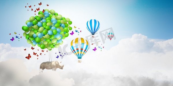 safari摄影照片_飞行犀牛犀牛飞行在天空高在一束五颜六色的气球