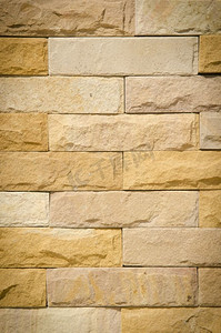 复古墙面摄影照片_图案复古色彩现代设计装饰凹凸不平的真石材墙面用水泥