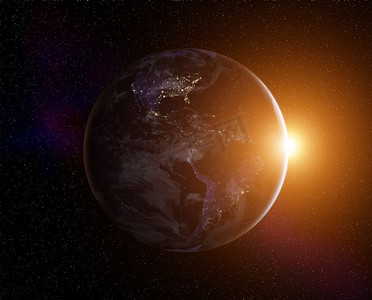 行星宇宙星球摄影照片_与上升的太阳的行星地球，从空间的视图.这张照片的元素由NASA提供
