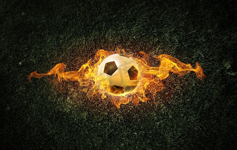 火焰摄影照片_好热的球。概念形象的足球在火火焰