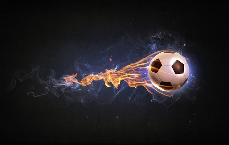 烟雾火焰摄影照片_好热的球。概念形象的足球在火火焰