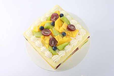 蛋糕店摄影照片_蛋糕糕点生日夹心芒果精致甜品鲜果蛋糕店烘焙多层