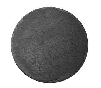 白色背景中隔离的用于盛放菜肴的空黑色圆形石墨板