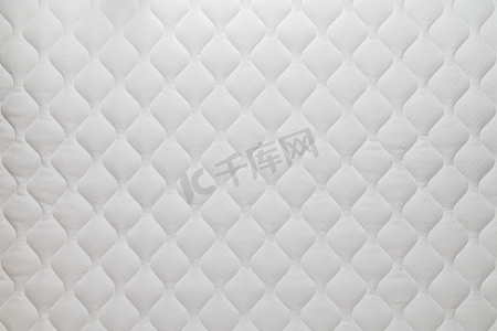 棕椰床垫摄影照片_柔软的白色床垫平坦的背景和质地。