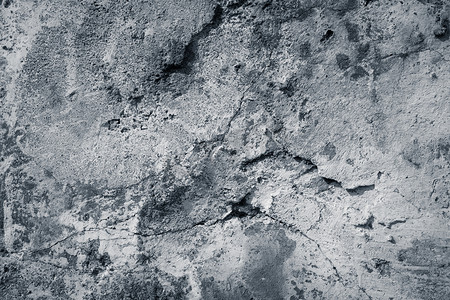 黑白地板背景摄影照片_黑色和白色破裂的地板纹理