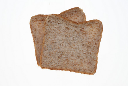 黑全麦粉摄影照片_在白色的全麦吐司面包片