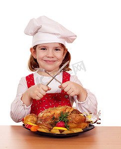 女孩吃鸡摄影照片_小女孩用烤鸡做饭工作室拍摄