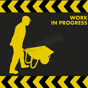 WORK IN PROGRESS 标志与工人一起携带手推车
