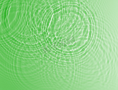 绿色水波纹摄影照片_抽象的绿色水波纹背景