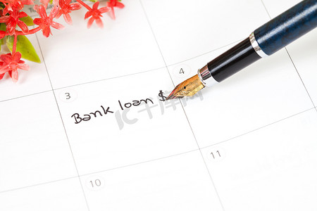 银行贷款贷款摄影照片_在日历中提醒“银行贷款”