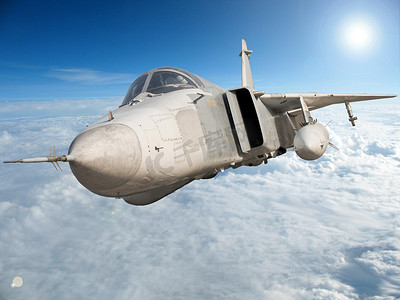 su摄影照片_军用喷气式轰炸机 Su-24 Fencer 飞越云层。