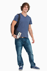 背着书包的学生摄影照片_背着书包的男学生画像