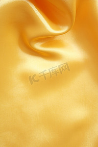 光滑优雅的金色丝绸可以用作背景