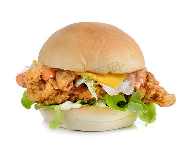 三明治背景摄影照片_白色背景中带鸡肉和奶酪的汉堡包
