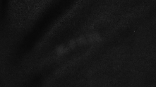 黑色摄影照片_黑布背景摘要与软波。