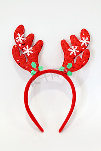 年节摄影照片_头带圣诞节，驯鹿鹿角红色娃娃头带发刷帽，用于圣诞节和新年节，白色背景中突显