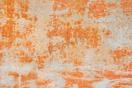 具有抽象生锈图案、腐蚀性橙色背景的旧金属质感
