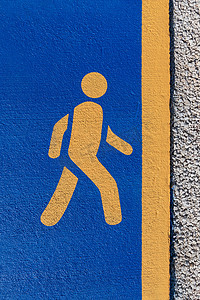 跑步标志，慢跑跑道上蓝色背景上的黄色跑步标志