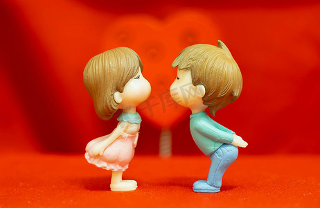 The Miniature Couple dolls Boy and Girl Romantic Kiss on Red Hea