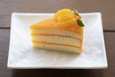 切片水果摄影照片_水果橙子果酱奶油蛋糕