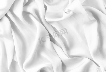 质感丝绸摄影照片_奢华的白色柔软丝绸平底背景质感，假日美感抽象背景