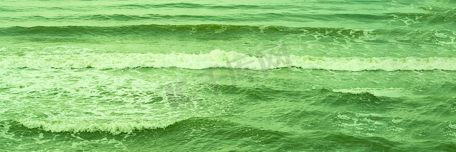 真实照片海水波浪，抽象背景，自然力量，亮绿色更多色调库存