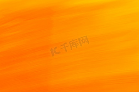 具有渐变、小波浪和线条的橙黄色调的抽象背景。