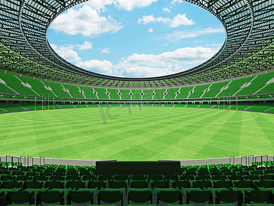 会员卡vip摄影照片_美丽的现代圆形澳大利亚规则足球场，配有绿色座椅和 VIP 包厢