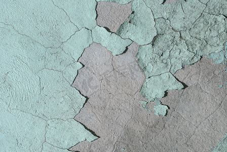 有旧石膏碎片、碎片油漆、海蓝宝石颜色纹理、背景的混凝土墙