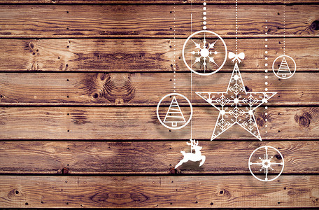 悬挂木板摄影照片_悬挂圣诞装饰品的复合图像