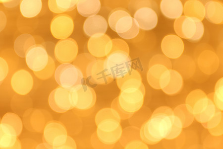 柔和的散景金黄色背景，散景金黄色五颜六色的圣诞快乐，新年快乐散景灯光在夜晚闪耀，散景闪光灯，金色奢华背景，闪闪发光的壁纸