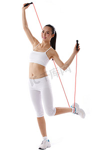 手臂侧面摄影照片_女人跳绳锻炼身体
