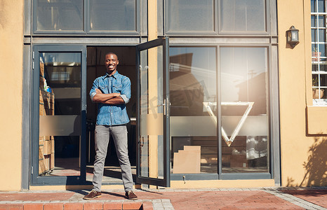 store owner standing in front of shop