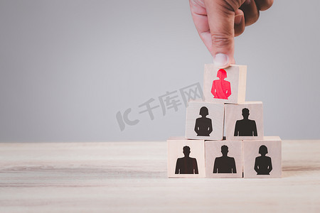 Human resources talent management and recruitment business building team, organization concept, Person icons on wooden cube block on top with woman leadership in business concept