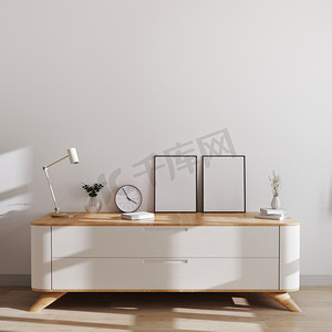 photo摄影照片_Blank photo frames in modern scandinavian style interior on beautiful chest of drawers with white wall and bright room. Photo frames in interior mockup, poster or picture frames, 3d rendering