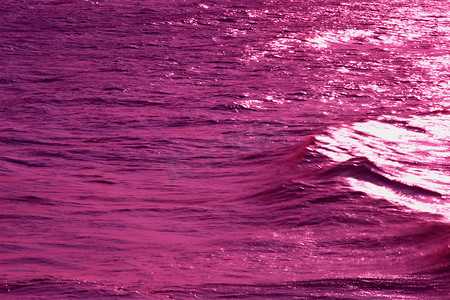 海面波纹摄影照片_日落时的海面