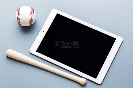 电脑背景图片_一块白色平板电脑，上面有棒球棒和手套