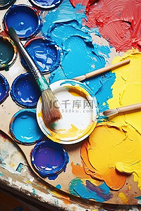 一幅画背景图片_白色颜料盒中的一幅画，里面有各种颜色的颜料和画笔