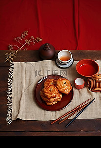 茶背景图片_红色桌布上的小盘油炸糕点