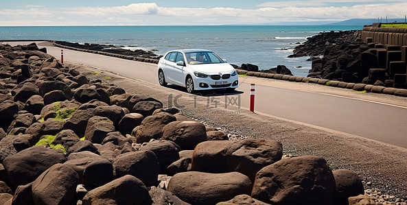五一车展背景图片_一辆白色汽车沿着一条布满岩石的狭窄小路行驶