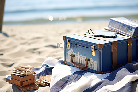 杂志背景图片_两个海滩手提箱和毛巾上的一本书