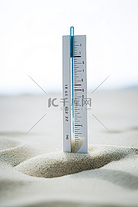 温度计温度计背景图片_温度计坐在沙子里