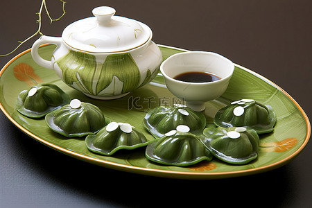 中秋背景图片_绿白花的茶具和碗