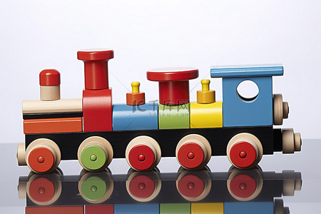 玩具交通工具背景图片_上面有彩色积木的玩具火车