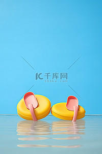 黄色漂浮物背景图片_橙色的漂浮物周围是黄色和蓝色的人字拖