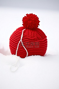 冬天温暖背景图片_雪上的毛线球