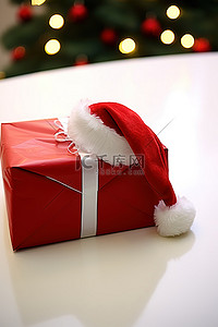 红色的帽子背景图片_一个红色的包裹，上面有一顶圣诞老人的帽子